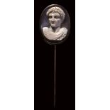 A modern agate cameo set in a metal stick pin. Bust of an emperor.