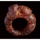 A roman amber finger ring with lion protome.