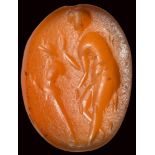 A roman carnelian intaglio. Priapic scene.