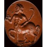 A fine roman red jasper intaglio. Centaur with attributes.