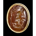 A very fine hellenistich jacinth intaglio. Seated satyr.