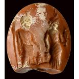 A roman agate intaglio. Zeus Sarapis, Isis and Harpokrates.