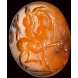 A roman carnelian intaglio. Centaur with a child.