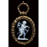 A fine neoclassical onyx cameo set in a chiseled gold pendant. Cupid hunter.