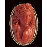 A fine Victorian coral cameo set in a gold brooch. Bacchante.