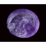 A roman amethyst intaglio. Eagle with prey.