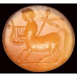 A roman carnelian intaglio. Centaur with attributes.