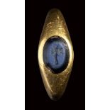 A roman nicolo intaglio set in a massive gold ring. Tree.