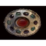 A late roman large gold brooch set with an agate, garnets and emeralds