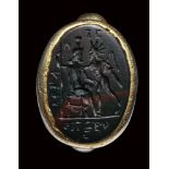 A roman magical green and red jasper intaglio set in an ancient electrum ring. Serapis and Helios wi