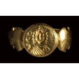 A late roman gold signet ring, with engraved bezel. Female bust with inscriptions.