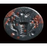 A roman heliotrope intaglio. Allegorical emblema.