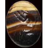 A roman banded agate intaglio. Seated reader.