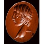 A roman red jasper intaglio. Bust of ephebus.