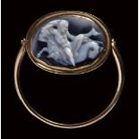 An roman agate cameo mounted on a modern gold ring. A youth on a seagoat.