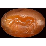 A roman carnelian intaglio. Two heifers.