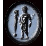 A roman nicolo intaglio. Athlete with herm.