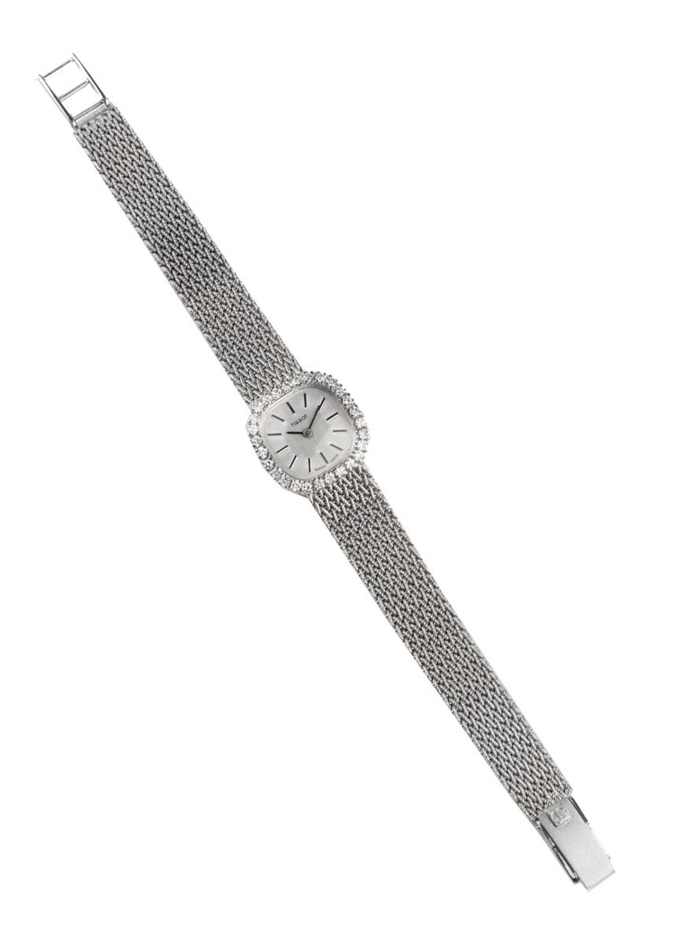 TISSOTMontre de dameEn or gris 18k (750), boîtier coussin, lunette sertie de 28 diamants taille