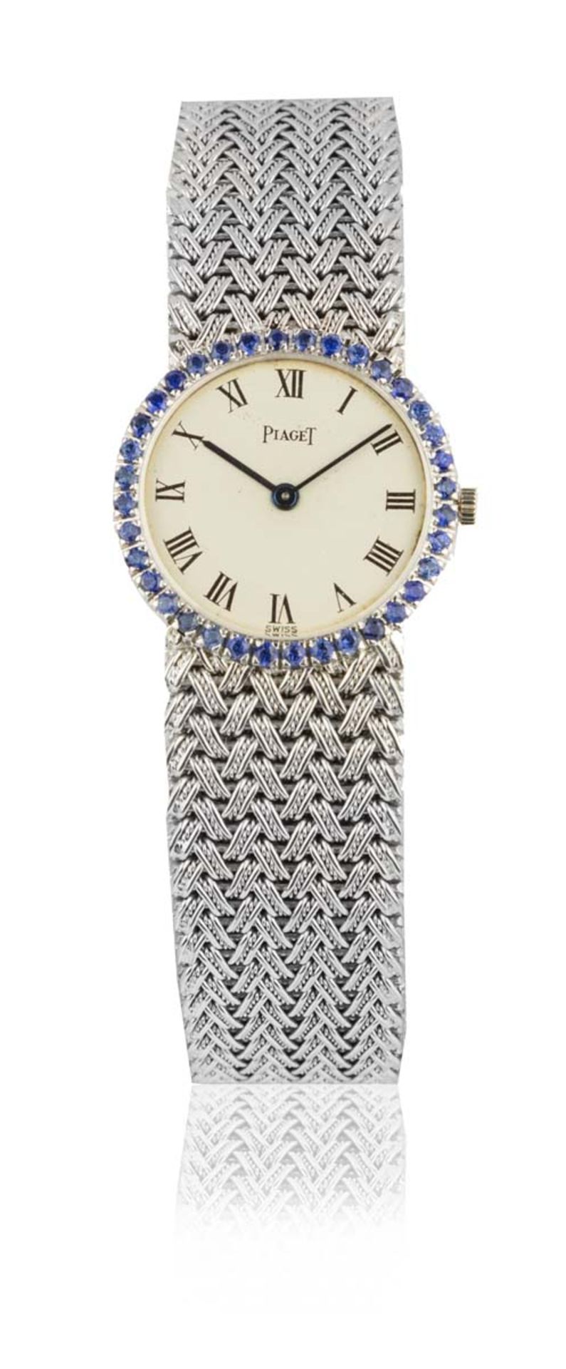 PIAGETMontre de dame extra plateEn or gris 18k (750), boîtier rond, lunette sertie de saphirs,