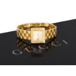 A LADY'S GOLD WRISTWATCH BY GUCCI, the mother-of-pearl dial with baton hands, the case in the