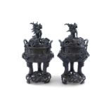 A LARGE PAIR OF BRONZE 'DRAGON' TRIPOD CENSERS ON STANDS, Qing Dynasty, 19th century, the detachable