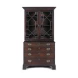A 19TH CENTURY MAHOGANY COMPOSED BOOKCASE, with moulded dentil cornice above twin astragal glazed
