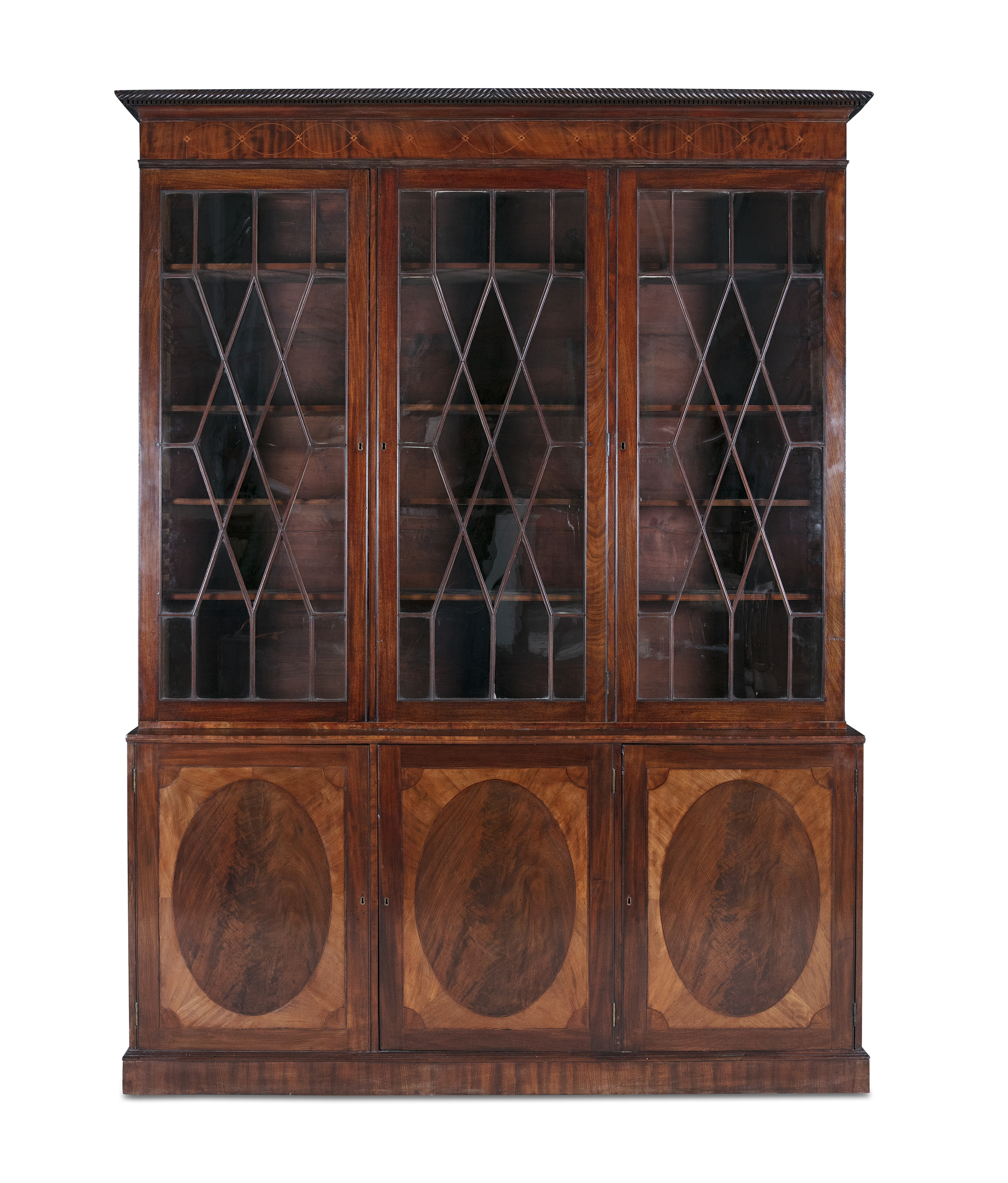 A 19TH CENTURY INLAID MAHOGANY BOOKCASE, fitted three astragal glazed panel doors enclosing a