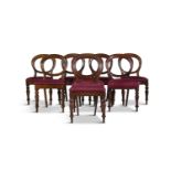 A SET OF EIGHT VICTORIAN MAHOGANY FRAMED BALLOON BACK DINING CHAIRS, with drop-in seats covered in