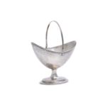 A GEORGE III IRISH SILVER BRIGHT-CUT SWING HANDLE SUGAR BASKET, Dublin c.1792, lacking maker's mark,