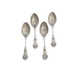 A SET OF FOUR VICTORIAN SILVER GILT BERRY SPOONS, Birmingham c.1873, mark of Elkington & Co., the