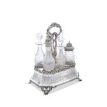 A VICTORIAN SILVER SIX BOTTLES CONDIMENT STAND, Sheffield c.1864, by Martin Hall & Co, with raised