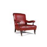 A VICTORIAN OAK FRAMED UPHOLSTERED ARMCHAIR, the scroll back, seat and arm rests covered in red