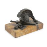 A FRENCH 19TH CENTURY BRONZE PAPERWEIGHT, the Roman soldier's helmet, sword and axe on a rectangular