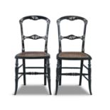 A PAIR OF VICTORIAN BLACK PAPIER MACHE SALON CHAIRS, the frames decorated with mother of pearl and