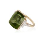 A TOURMALINE AND DIAMOND COCKTAIL RING, the fancy-cut green tourmaline between round brilliant-cut