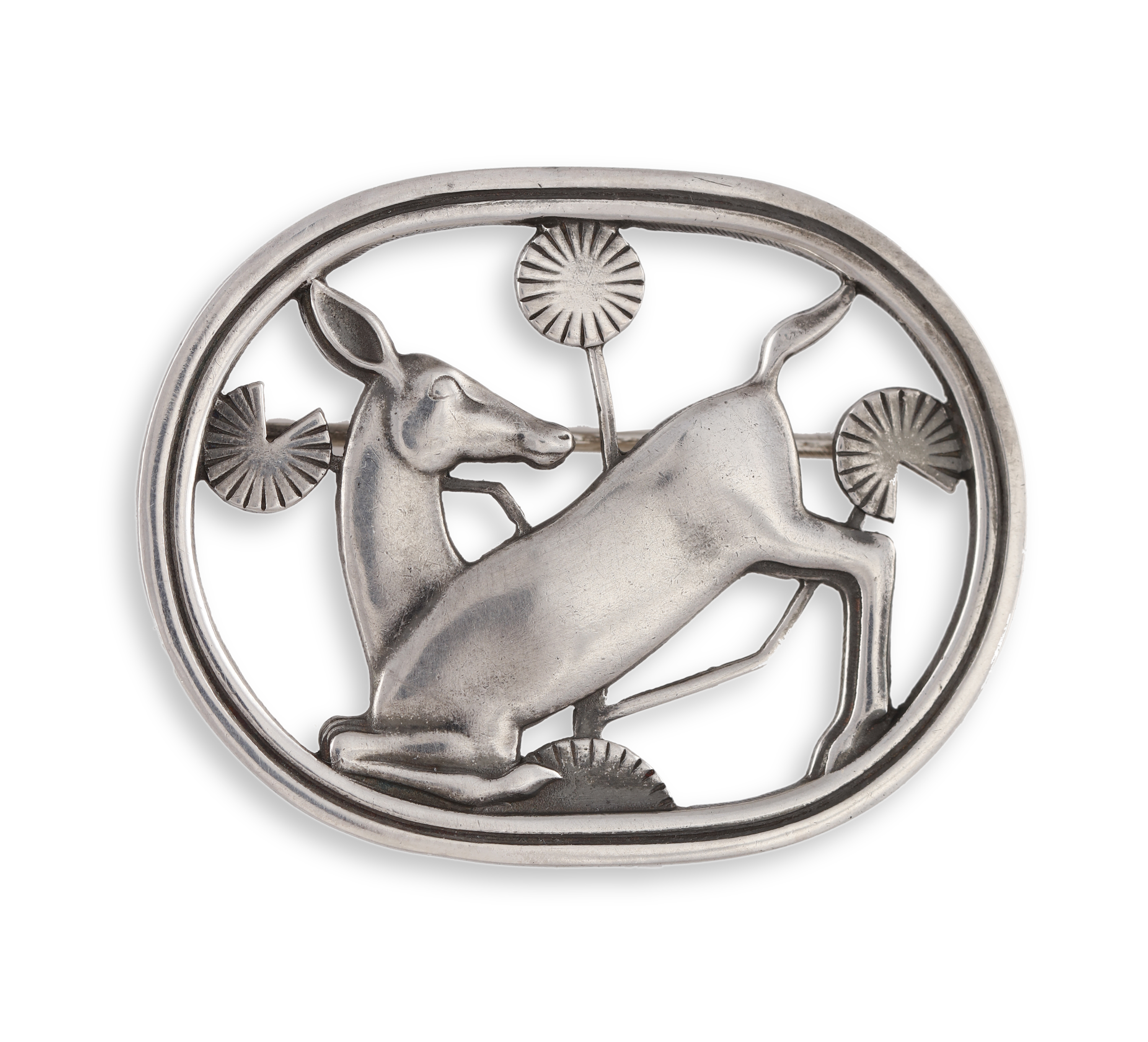 A SILVER BROOCH BY GEORG JENSEN, designed by Arno Malinowski, the oval-shaped brooch of doe motif,