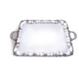 A SILVER PLATED TRAY AND DISH COVER, the tray of shaped rectangular form, with twin handles, and