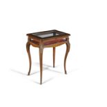 A LOUIS SEIZE STYLE ROSEWOOD MARQUETRY SHAPED RECTANGULAR CURIO TABLE, the glazed lift top enclosing