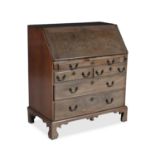 A GEORGE III MAHOGANY SLOPEFRONT WARRIOR BUREAU, with well fitted interior raised on an