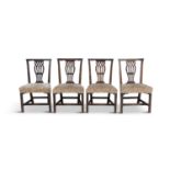 A SET OF FOUR GEORGE III MAHOGANY FRAMED DINING CHAIRS, the straight crest rail above pierced vase