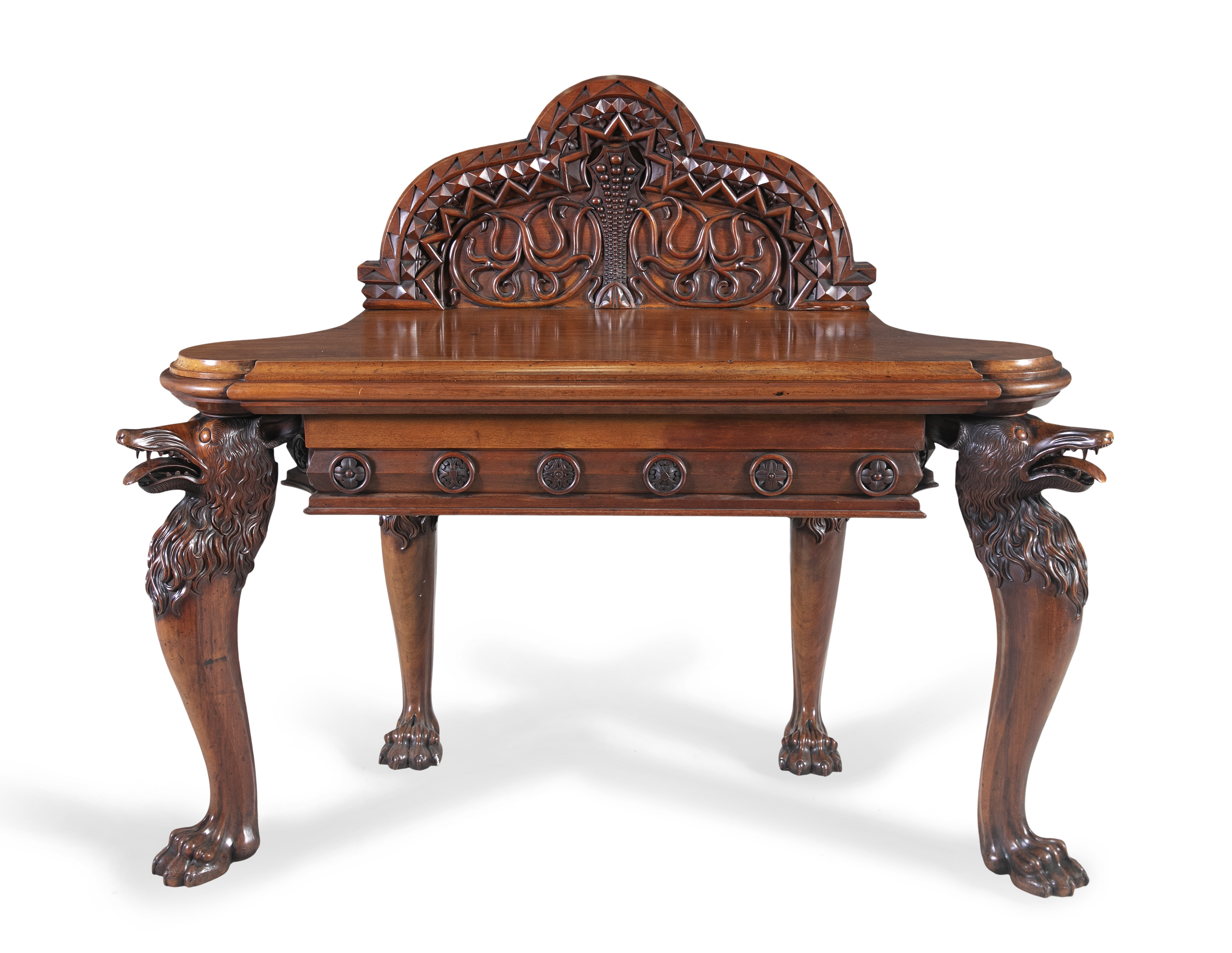 A 19TH CENTURY IRISH WALNUT SIDE TABLE, the arched backboard heavily carved with geometric bands and