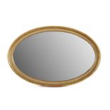 AN OVAL GILTWOOD FRAMED VICTORIAN MIRROR. 128cm high x 85cm wide