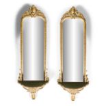 A PAIR OF VICTORIAN GILTWOOD AND GESSO PIER MIRRORS, c.1870, each with shaped rectangular plate,