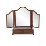 A MAHOGANY FRAMED TRIPTYCH TOILET MIRROR, raised on a base of two short drawers and bracket feet.