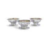 A SET OF THREE GEORGE III IRISH SILVER OPEN SALT CELLARS, Dublin c.1771, maker's mark of James Fray,