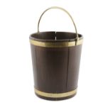 A GERORGE II MOHOGANY AND BRASS BOUND SLING HANDLE FUEL BUCKET, of slightly tapered form with brass