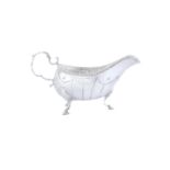 AN IRISH GEORGE III SILVER SAUCEBOAT, Dublin c.1785, mark of Mathew West, oval body with punched rim