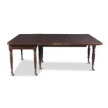 A WILLIAM IV MAHOGANY RECTANGULAR DINING TABLE, with reeded rim and raised on turned lobed