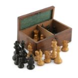 A TIMBER CASED SET OF JACQUES-STYLE TURNED WOOD CHESSMEN