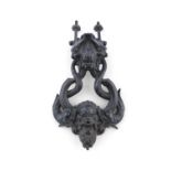 A LATE 19TH CENTURY CAST IRON DOOR KNOCKER AND BUTTON RECEIVER, in the form of sea creatures, cast